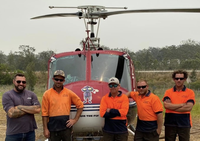 Crew Shot In Front of Helicopter